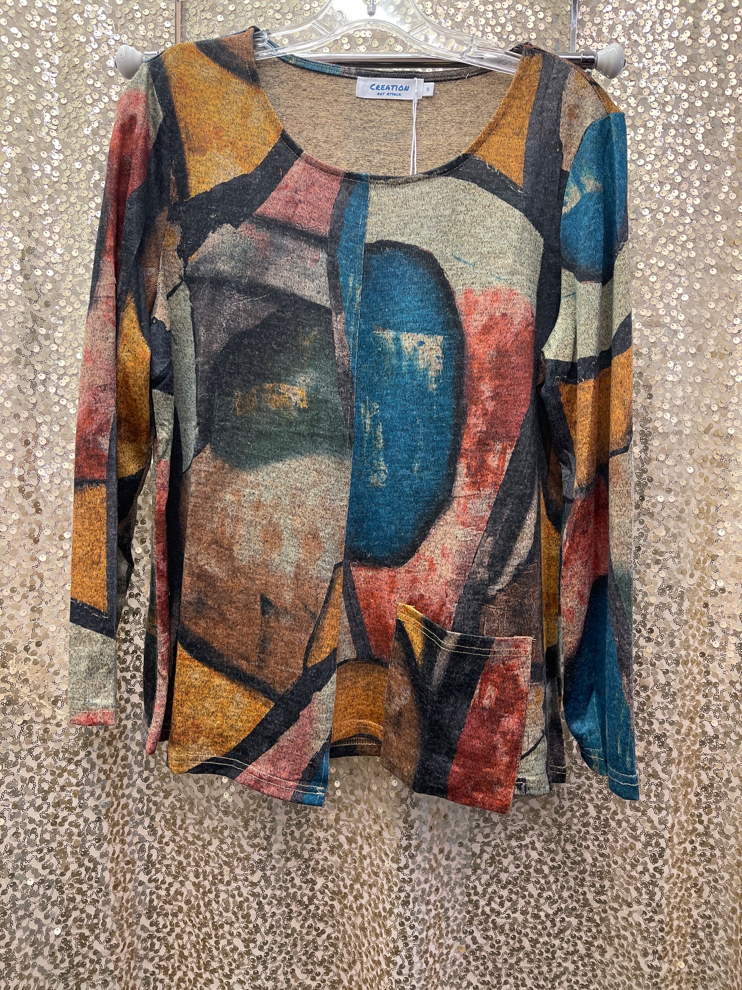 CREATIONS ASYMMETRICAL HEM TOP