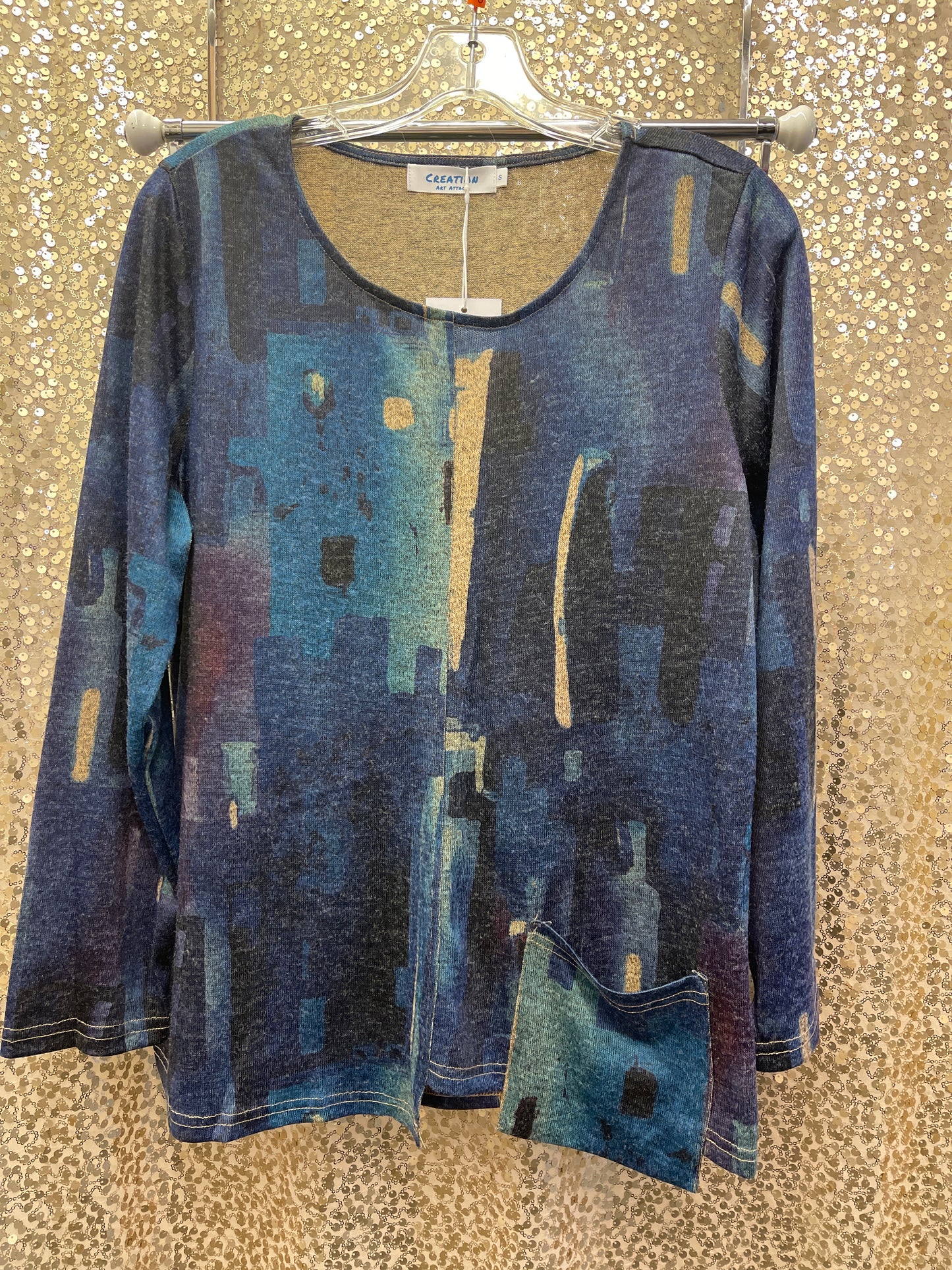 CREATIONS ASYMMETRICAL HEM TOP